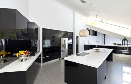 very spacious black and white themed kitchen with island