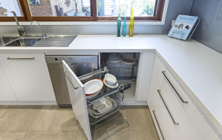 kitchen with fold out plate storage cupboard